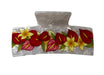 A clear plastic hair claw clip decorated with a colorful tropical floral pattern featuring red anthuriums, yellow plumeria, and pink flowers with green leaves, shown on a light gray textured background.