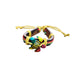Colorful turtle-shaped bracelet with a yellow cord on a white background