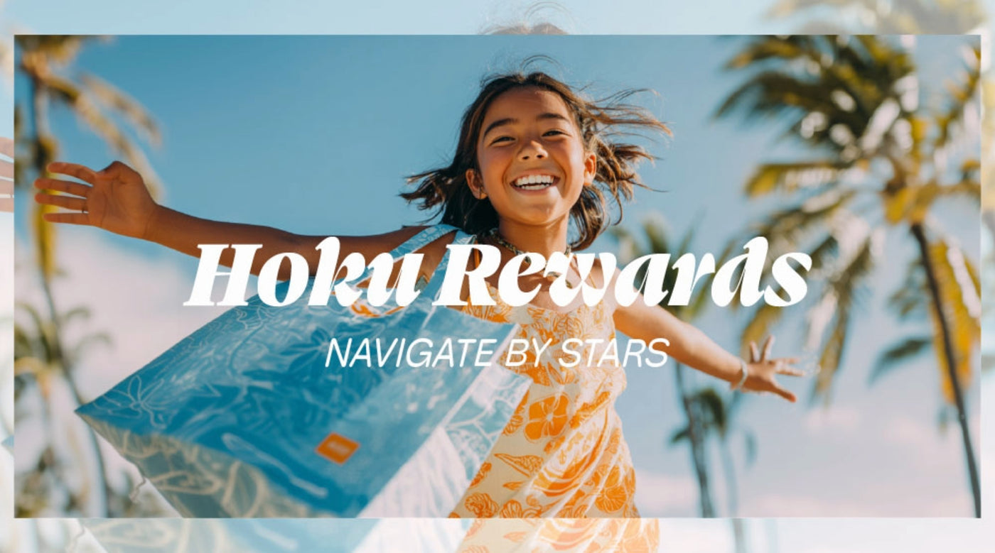 Child with open arms against a blue sky with 'Hoku Rewards' text overlay