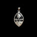 A silver Guam pendant featuring a palm tree and engraved landscape design, displayed on a textured dark gray background.