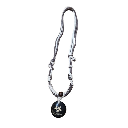 Necklace with a black pendant on a white background